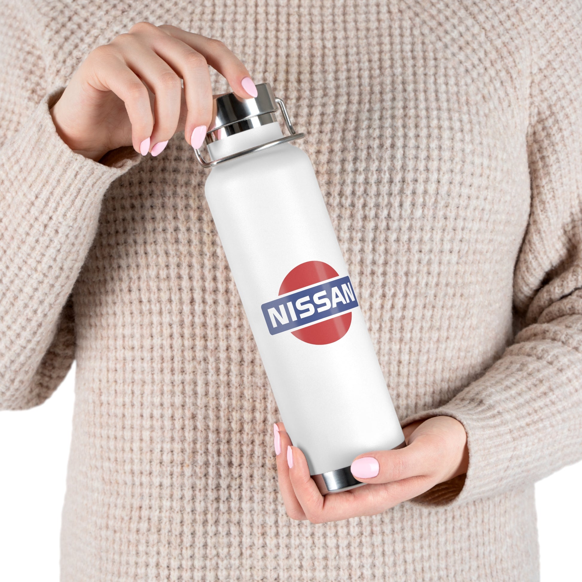 Woman holding the White Vintage Nissan Water Bottle. Nissan Branded water bottle