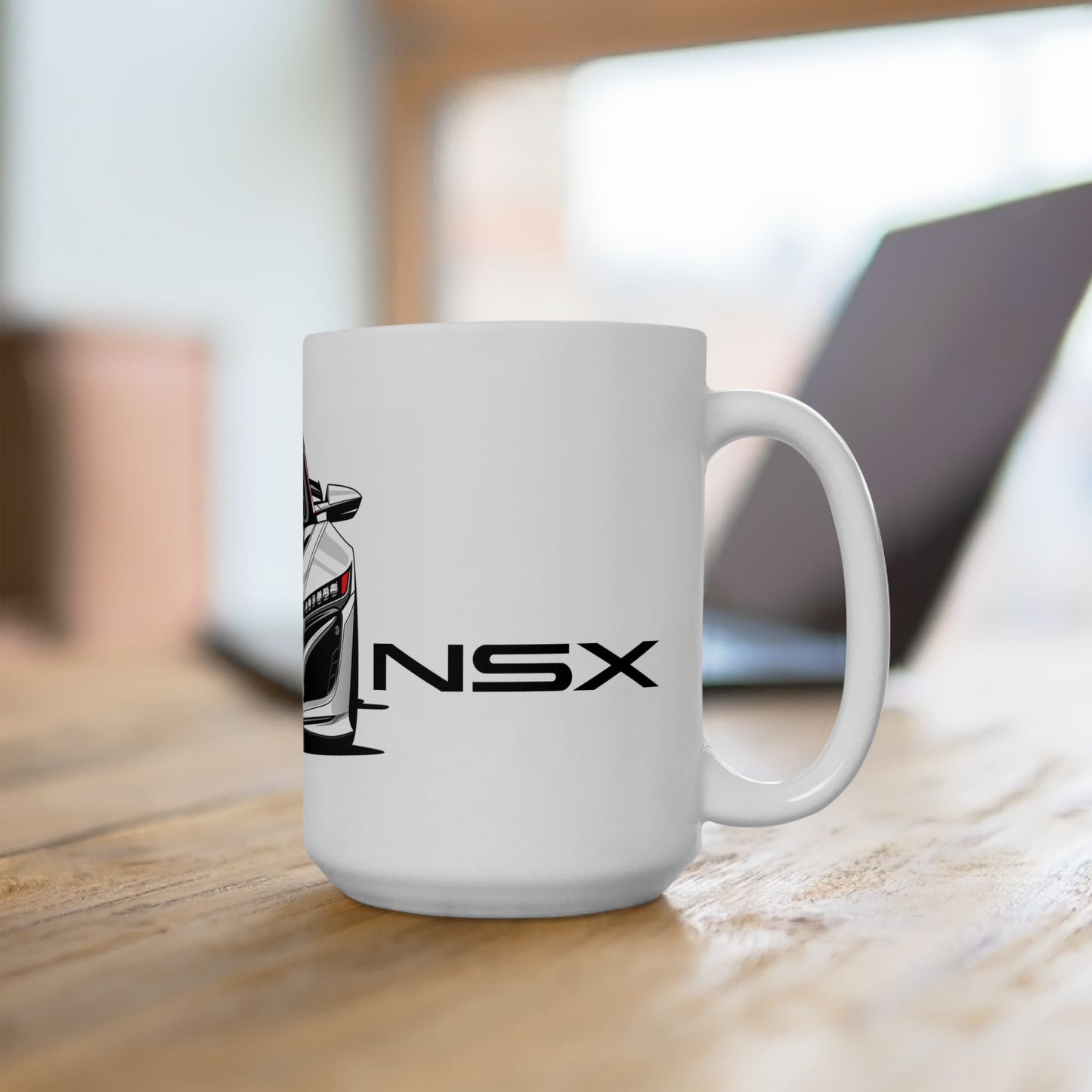 Lifestyle view of the 15oz White Coffee Mug with an Acura NSX with the NSX emblem placed beside the car.   