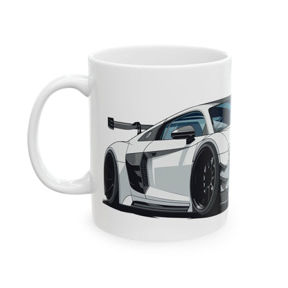 Left view of 11oz White Coffee Mug with an Audi R8 with the R8 emblem placed behind the car.  