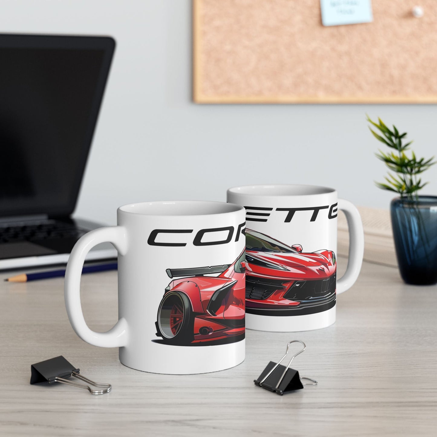 Lifestyle view of the 11oz White Coffee Mug with a Chevrolet Corvette C8 with the Corvette emblem placed above the car.  