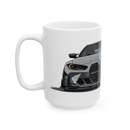 Left side view of the 15oz White Coffee Mug with a Grey BMW M4 GTS with the M emblem placed behind the car.  