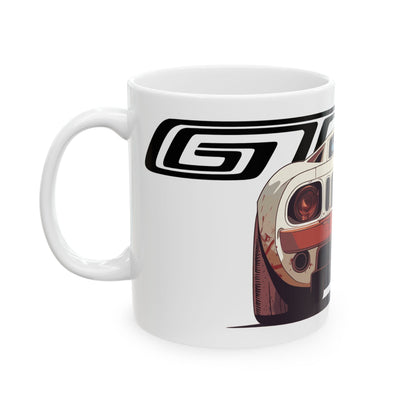 Left view of 11oz White Coffee Mug with a Ford GT with the GT emblem placed behind the car.  