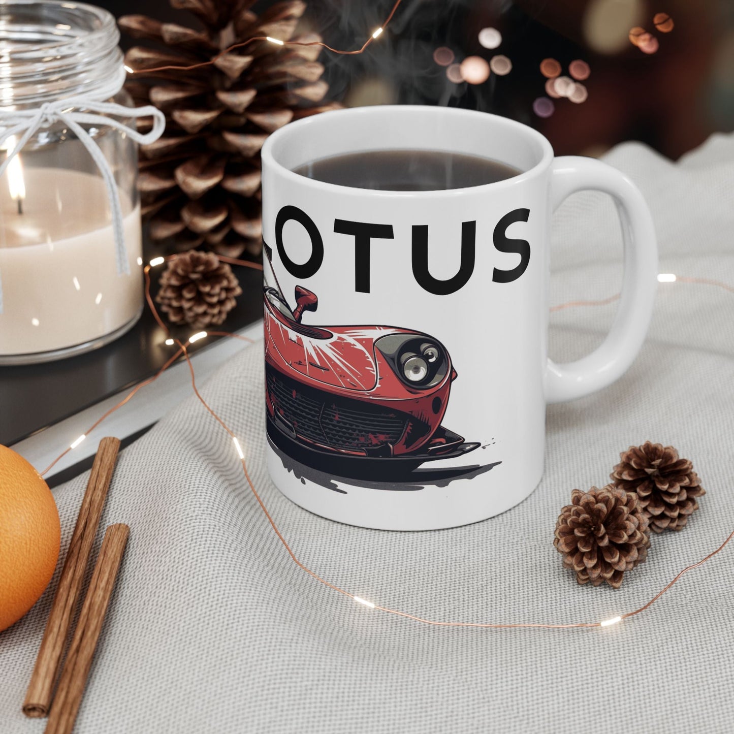 Lifestyle view of the 11oz White Coffee Mug with a Lotus Elise with the LOTUS emblem placed behind the car.  