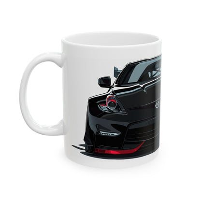 Left view of 11oz White Coffee Mug with a Nissan 370z with the 370z emblem placed behind the car.  