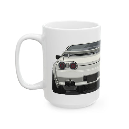 Left side view of the 15oz White Coffee Mug with a Nissan Skyline R32 with the GTR emblem placed behind the car. 