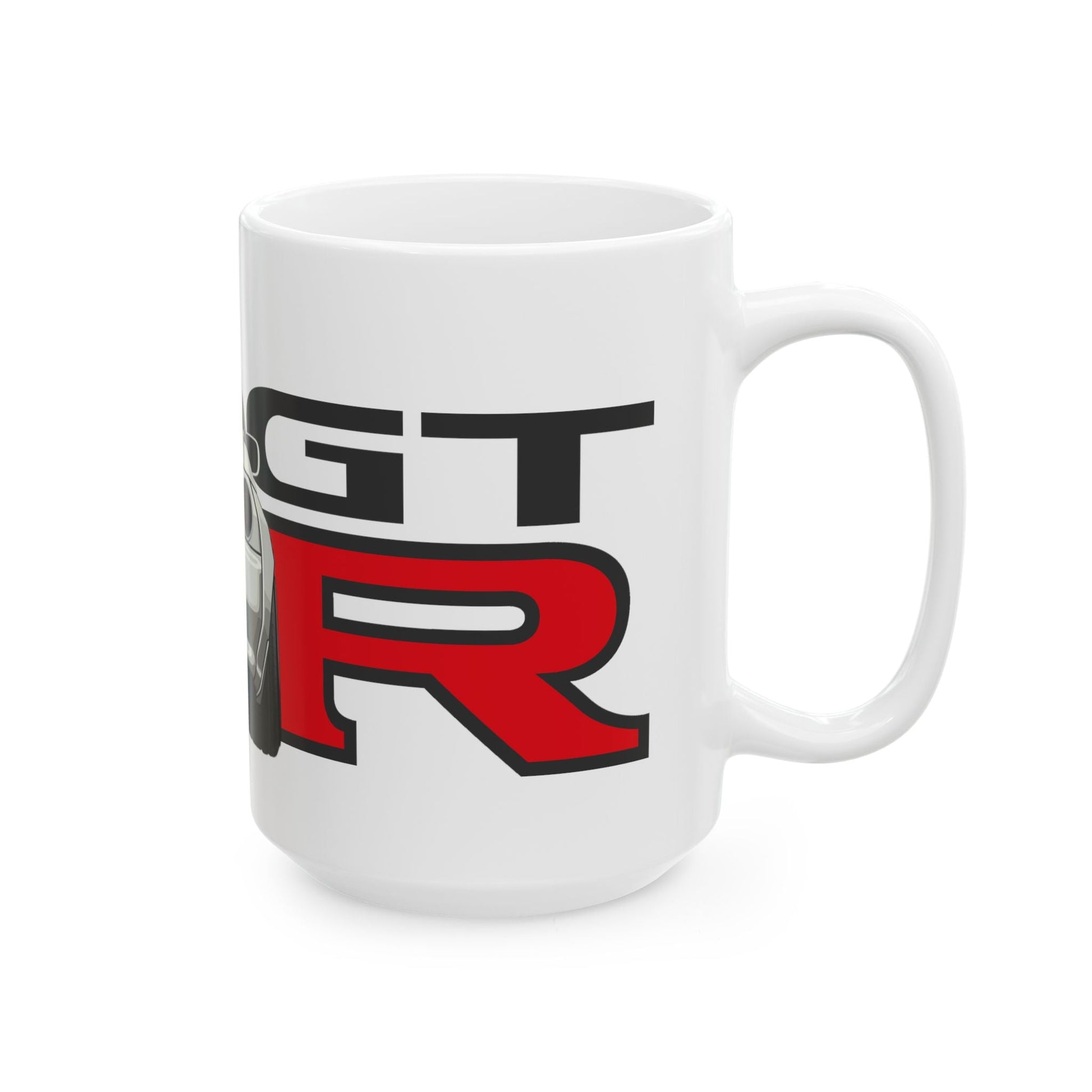 Right side view of the 15oz White Coffee Mug with a Nissan Skyline R32 with the GTR emblem placed behind the car. 