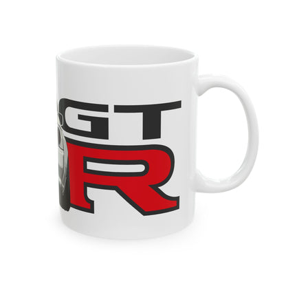 Right view of the 11oz White Coffee Mug with a Nissan Skyline R32 with the GTR emblem placed behind the car. 