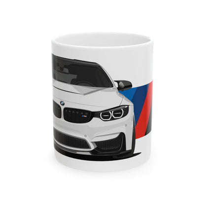 11oz White Coffee Mug with a White BMW M4 with the M emblem placed behind the car. 